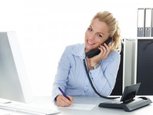 Pretty young woman has a good call in business